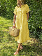 Robe femme maxi fluide boutonnée col rond manches courtes élégante été